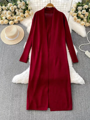 Burgundy knitted maxi dress and open front cardigan ensemble with long sleeves.