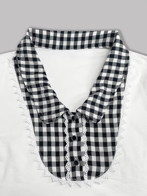 White maternity shirt with black gingham collar, lace trim, and decorative buttons.