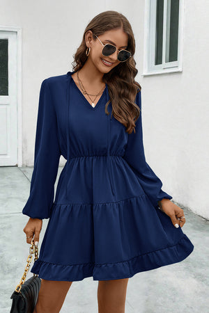 Navy tiered ruffle sleeve mini dress with V-neck and tie detail