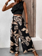 Black asymmetrical ruffle crop top and wide-leg palm print pants set