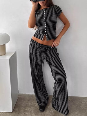 Striped cropped button-down top and wide-leg pants set in dark gray.