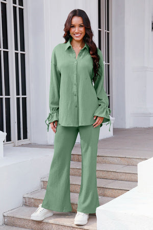 Sage green textured tie-sleeve co-ord set with flared pants and button-up shirt.