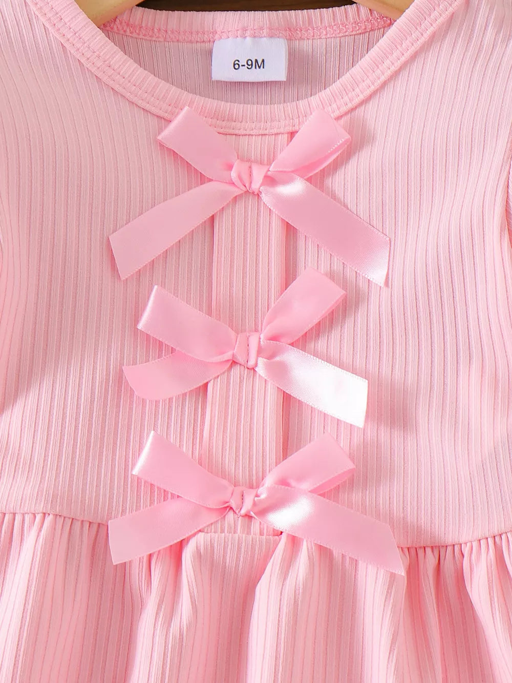 Children's Ribbed Bow Top And Shorts Set in Pink, close-up detail