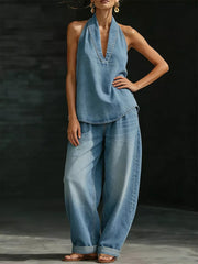 Blue denim halter neck top with deep v-neck and wide-leg pants.