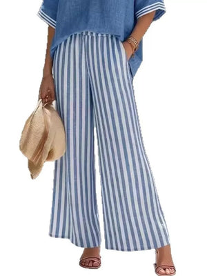 Blue and white striped wide-leg pants with elastic waist, paired with a blue V-neck top.
