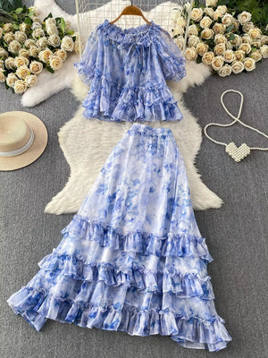Sky blue floral ruffle set with bow detail crop top and tiered skirt.