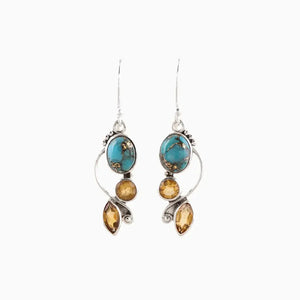 Turquoise and citrine sculptural dangle earrings in silver with unique artistic design.