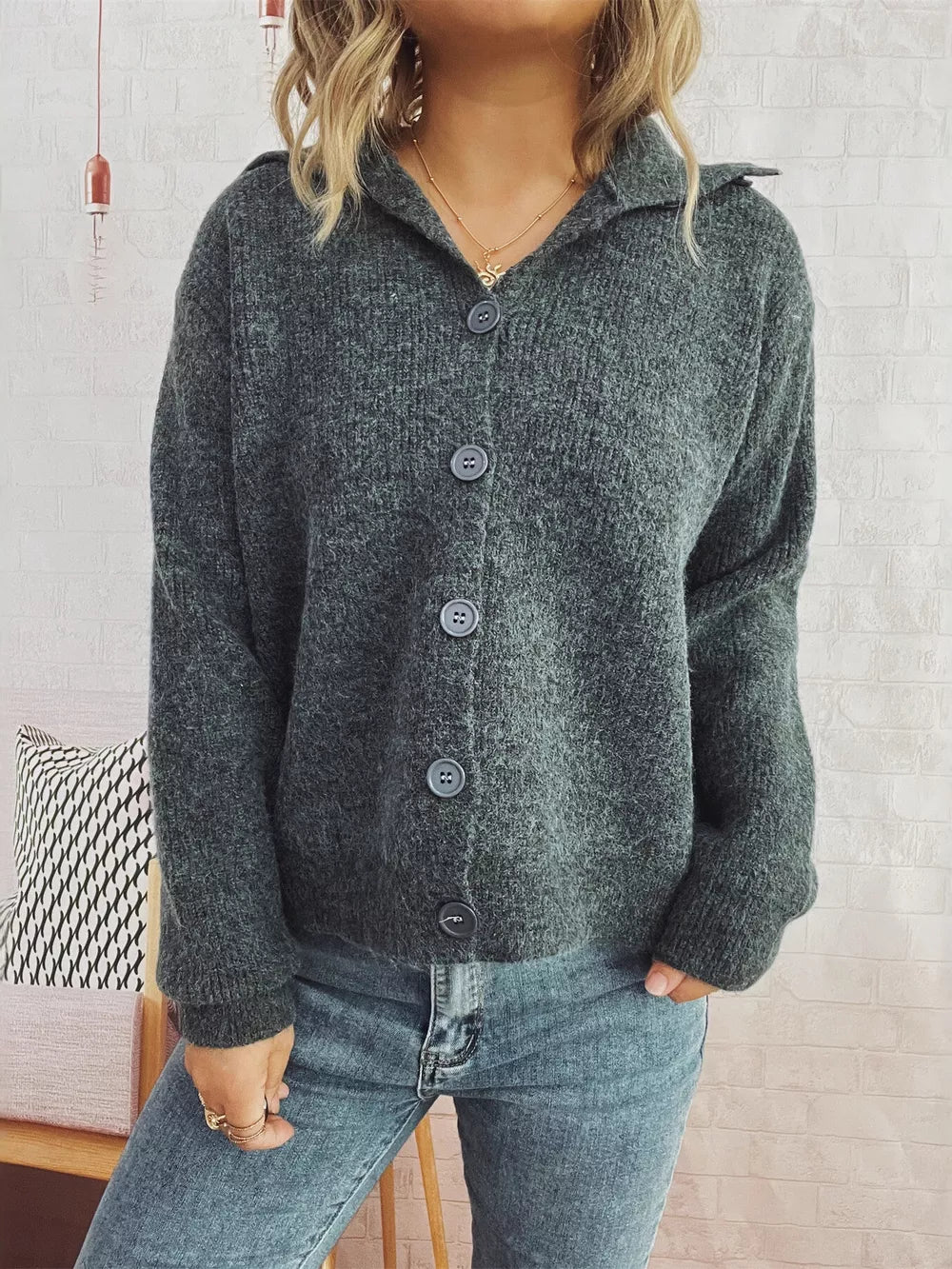 Gray ribbed button-up cardigan with polo collar and four buttons.