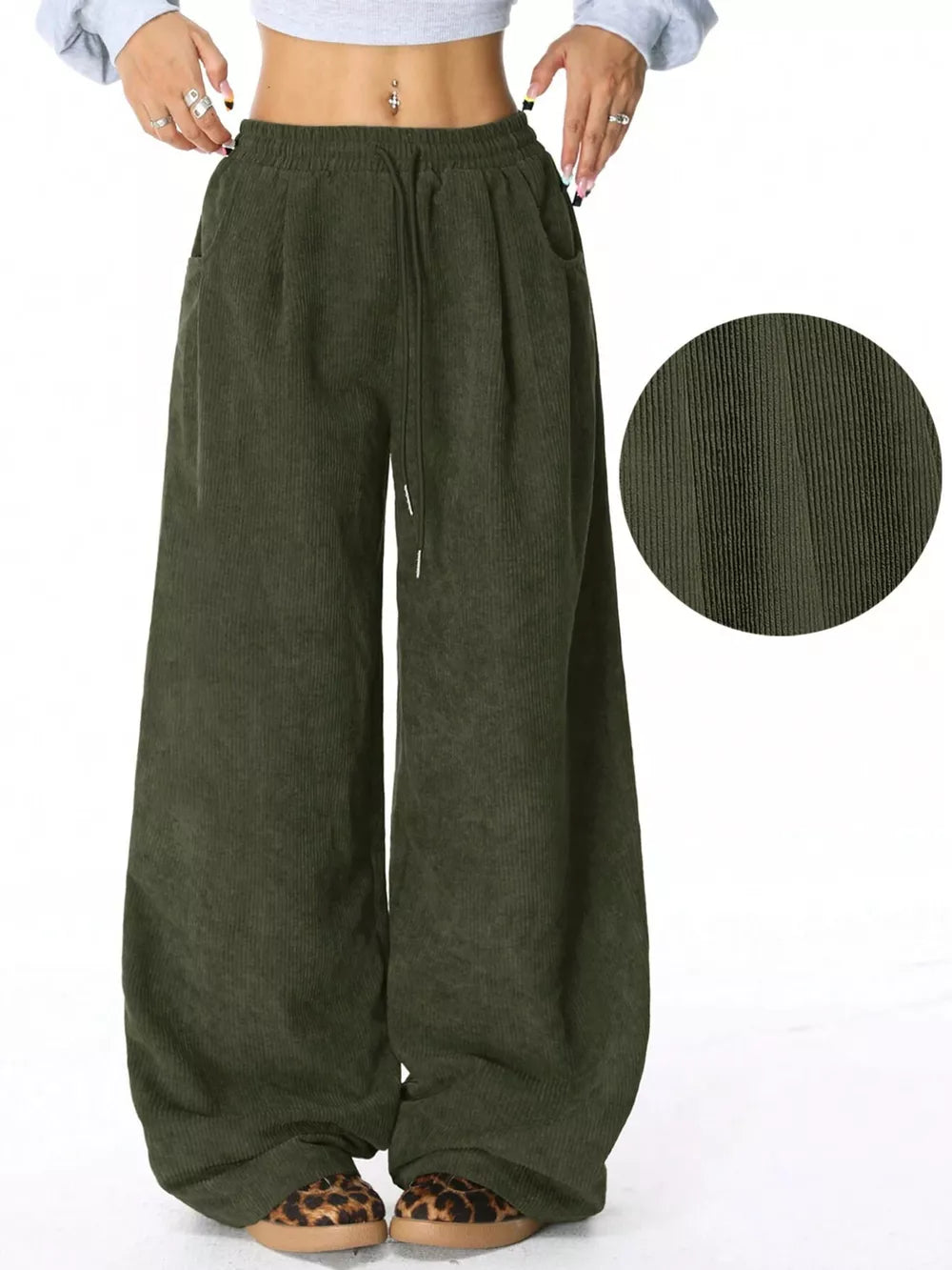 Army green corduroy maternity trousers with wide legs and drawstring waist.