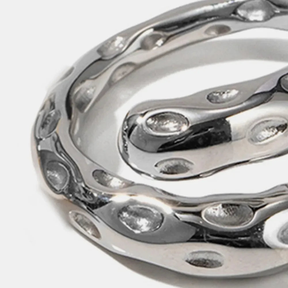 Sculpted silver bubble ring with organic, fluid design and cutouts.