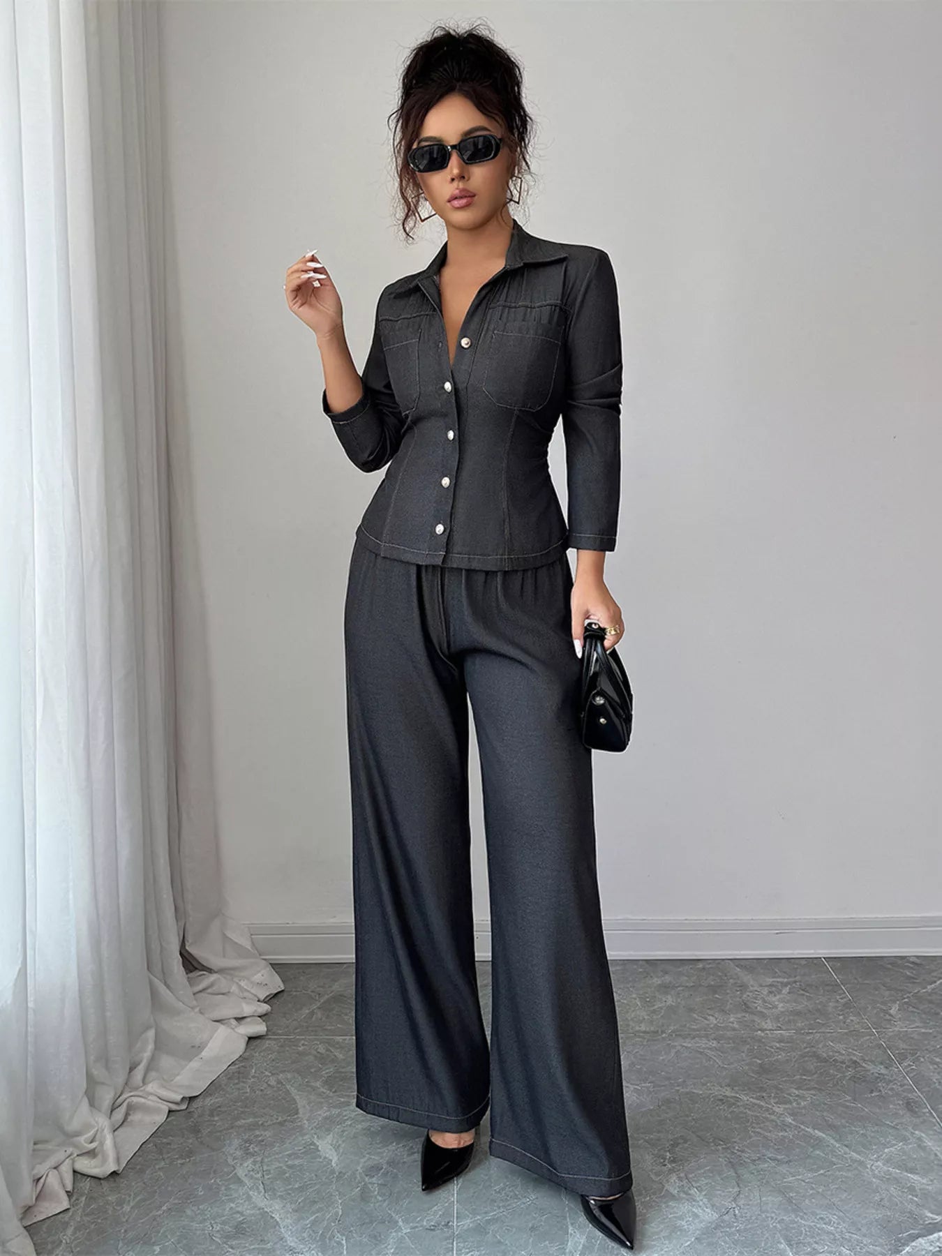Gray button-up shirt and wide-leg pants set with button details and elastic waist.