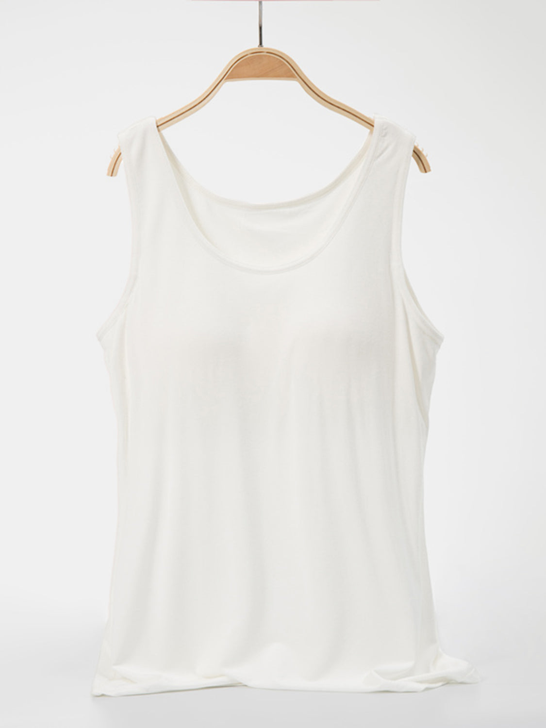 White scoop neck tank top with a relaxed fit.