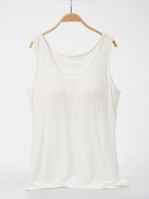 White scoop neck tank top with a relaxed fit.