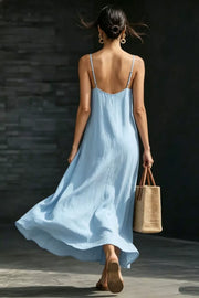 Light blue V-neck maxi dress with spaghetti straps and a breezy flowy skirt.