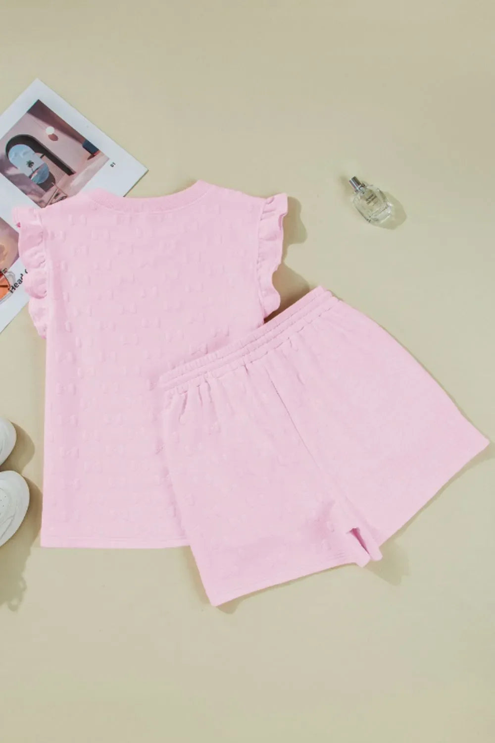 Blush pink embossed bow ruffle sleeve loungewear set with matching shorts.
