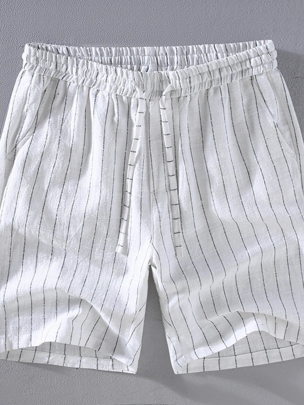 Men's white striped chino shorts with drawstring waist and pockets