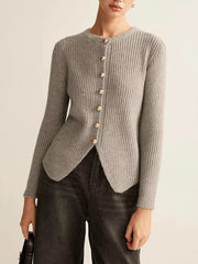 Grey ribbed knit cardigan with crew neck, gold buttons, and asymmetrical hem.