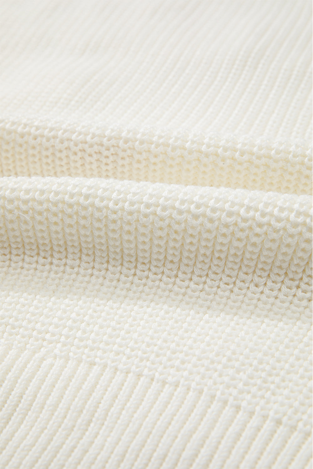 Ivory knit sweater with textured stitch detail