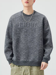 Men's dark gray acid wash sweatshirt with "ENJOY" graphic detail and crew neck.