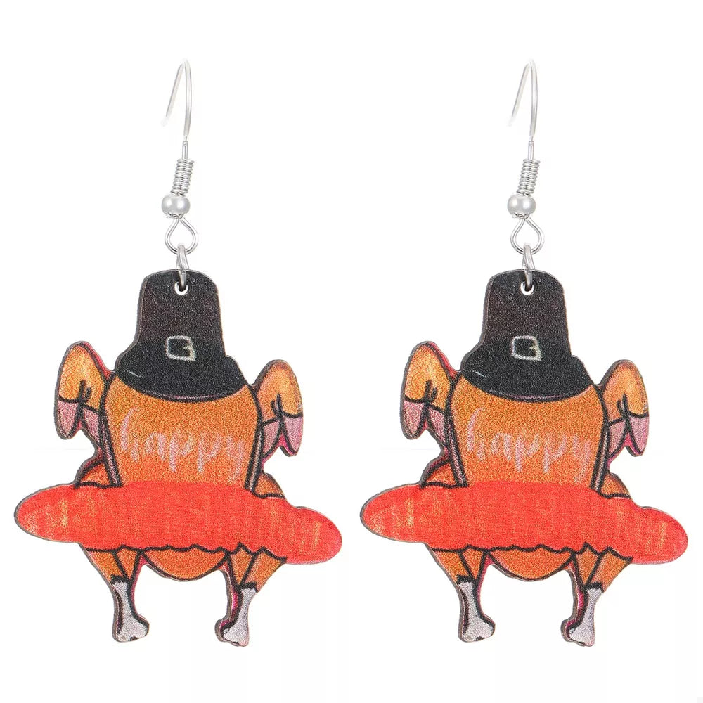 Thanksgiving turkey charm dangle earrings with pilgrim hats and orange accents.
