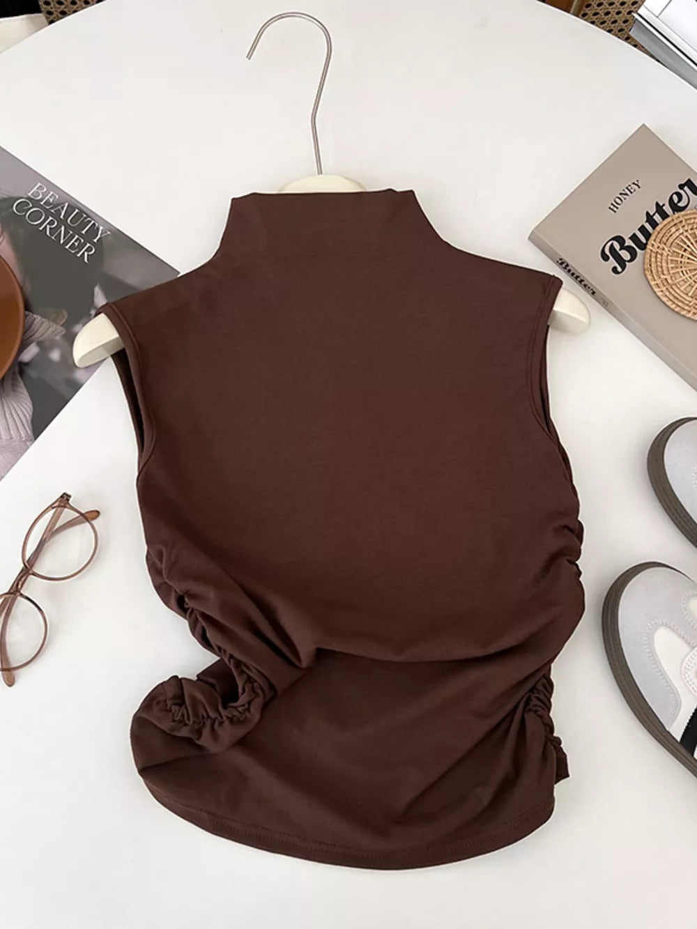 Brown ruched mock neck tank top with draped sides