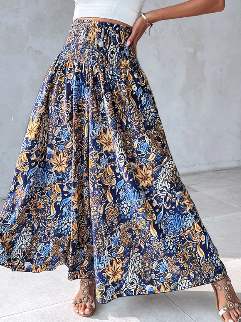 Bohemian print smocked waist pants in dark navy with a flowing wide leg.