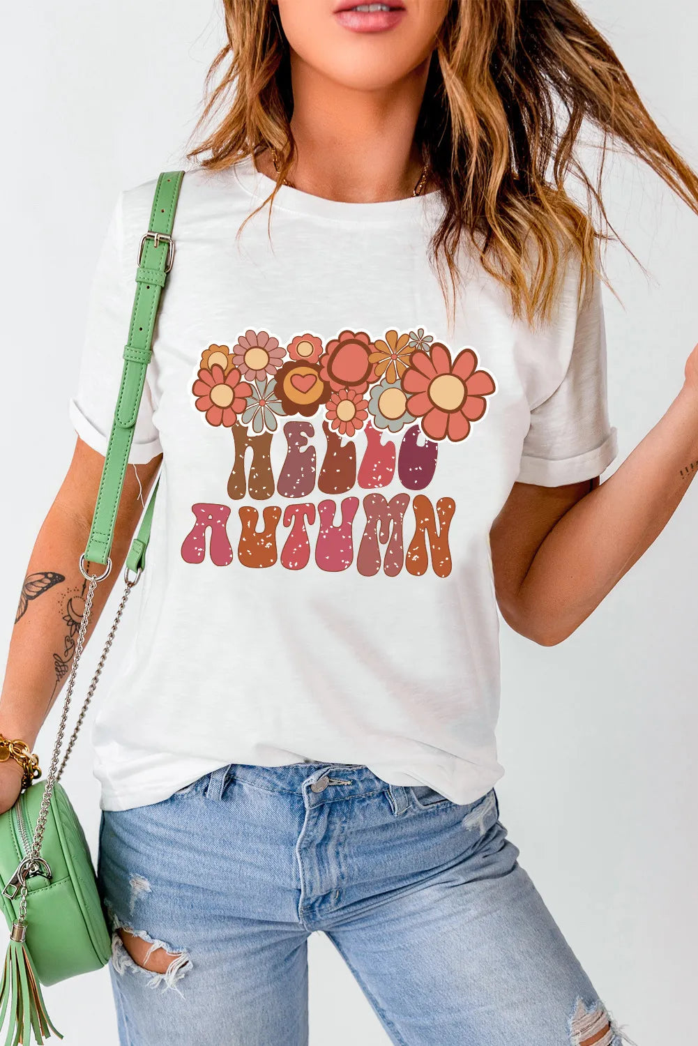 White t-shirt with retro floral graphic and "Hello Autumn" text, short sleeves, crew neck