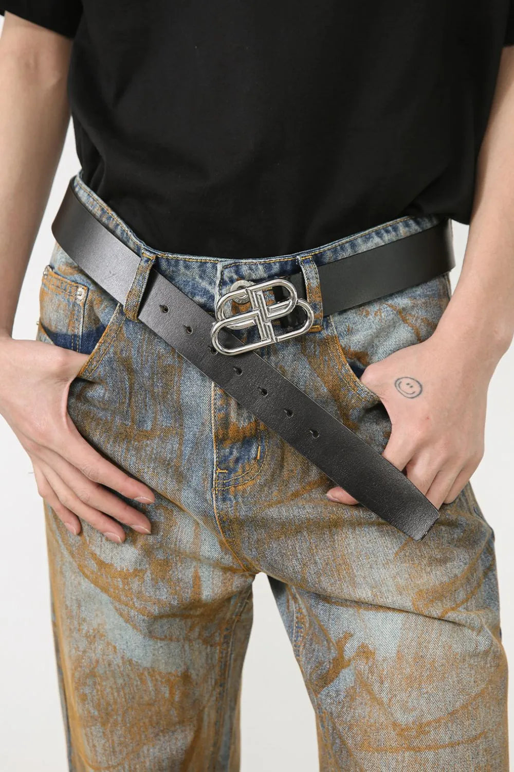 Acid wash denim relaxed fit trousers in medium with a statement silver buckle.