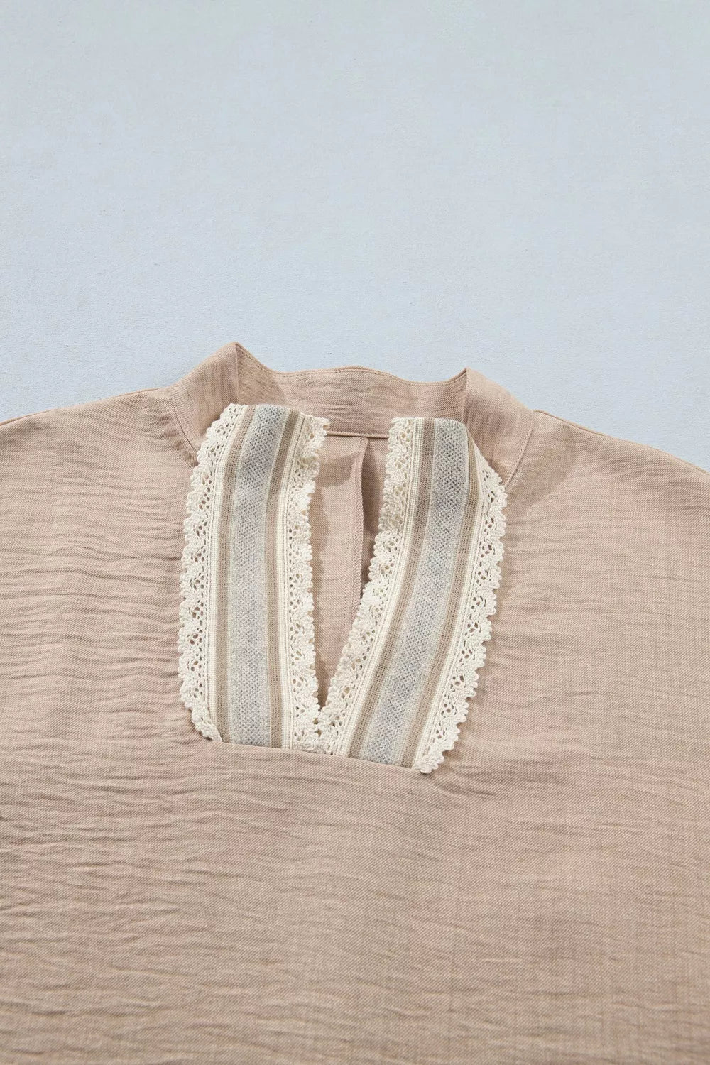 Beige crochet lace pullover with V-neck and striped inset detail