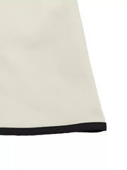 Beige A-line midi dress with black trim detail