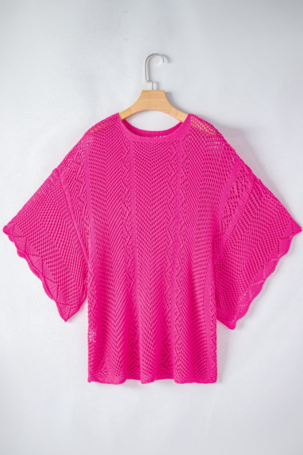 Hot Pink open-knit chevron sleeve top with a relaxed fit and scalloped hem.