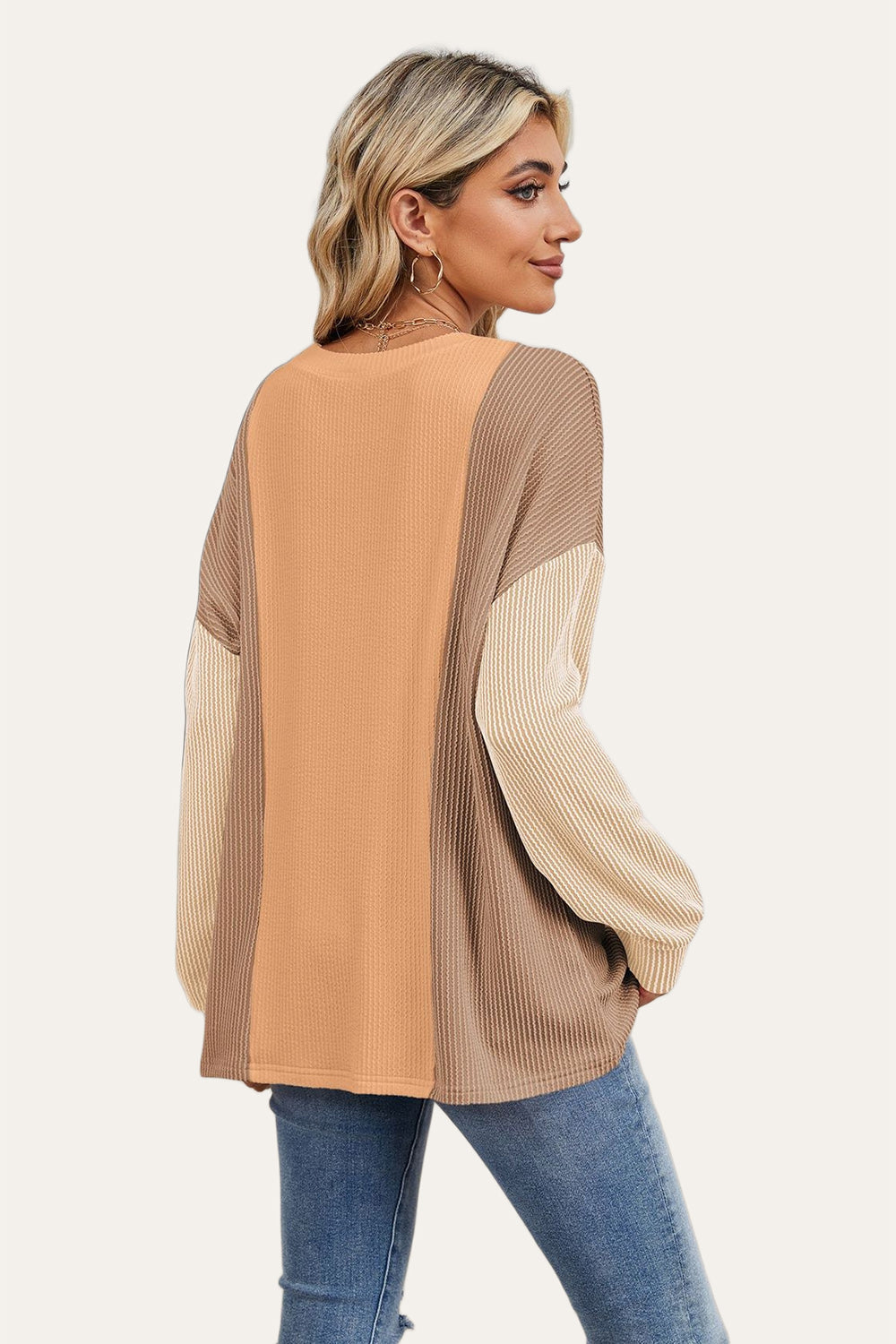 Colorblock waffle knit pullover sweater with long sleeves in tan, rust, and beige.