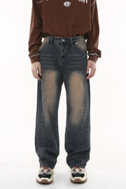 Vintage wash wide-leg jeans in dark gray with a faded effect and pleated front.