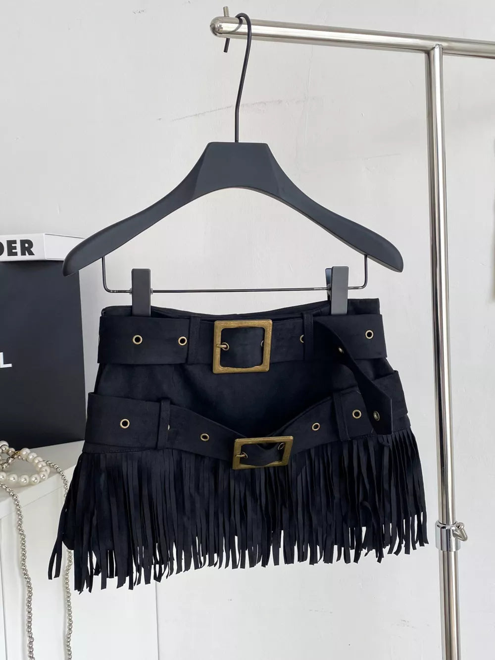 Black belted mini skirt with fringe and antique brass buckles.