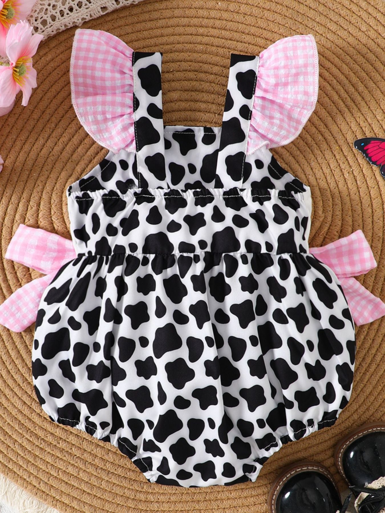 Baby one-piece with cow print, pink gingham ruffles and bows, cotton blend