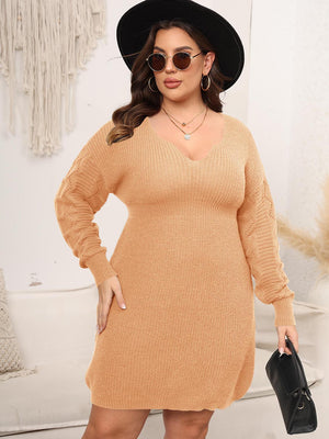 Sculpted knit midi dress in Sherbet with V-neck and textured sleeves.