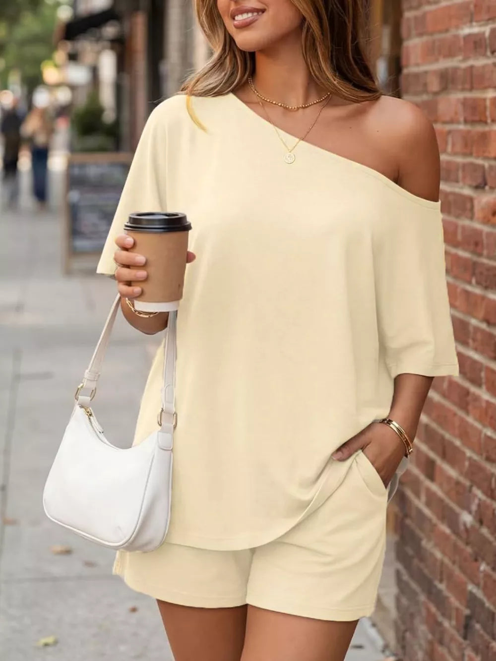 Asymmetrical one-shoulder peach set with shorts and pockets