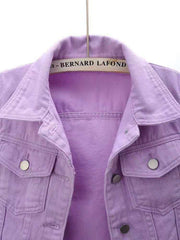 Lavender denim trucker jacket with button pockets and collar detail.