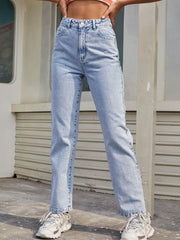 Light wash high-rise straight leg cotton denim jeans with button fly.