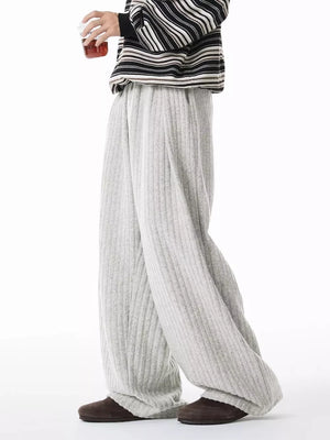 Relaxed ribbed knit sweatpants in light gray with a drawstring waist.