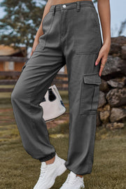 Dark gray utility cargo pants with multiple pockets and elastic cuffs.