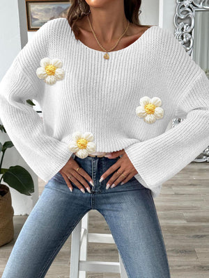 White knit sweater with floral appliqués and a slouchy fit.