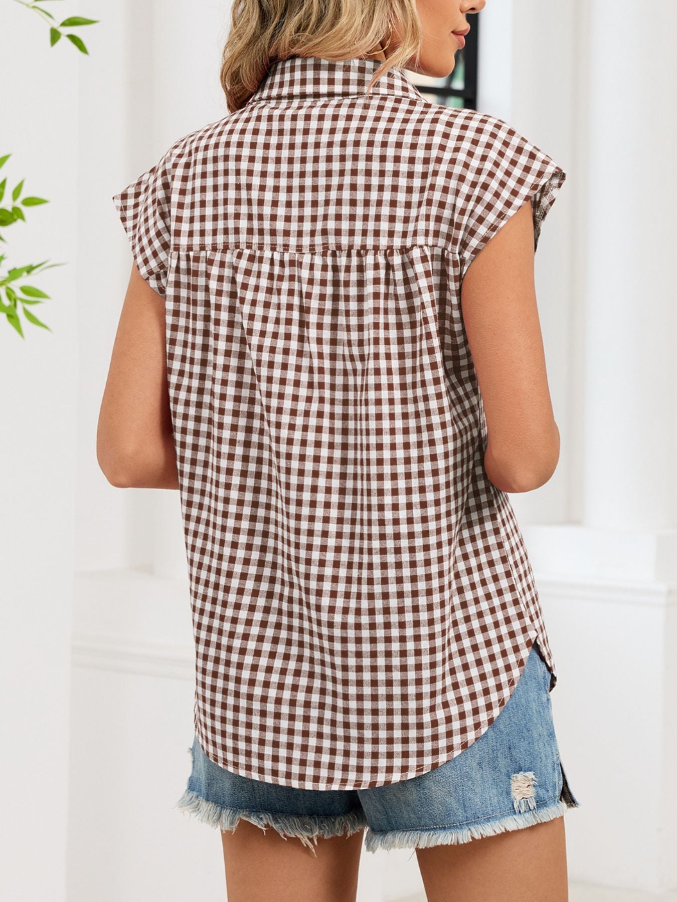 Brown gingham cotton shirt with cap sleeves and button-down front.