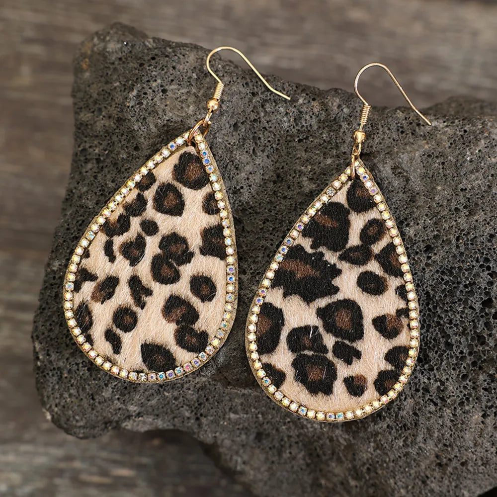 Leopard print teardrop earrings with crystal trim and gold hooks