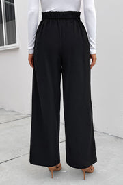 Black high-rise ruched wide-leg trousers with a paperbag waist detail.
