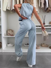 Light blue denim tied vest and relaxed fit pants set for women.
