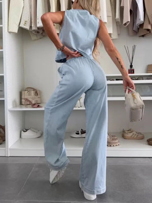 Light blue denim tied vest and relaxed fit pants set for women.