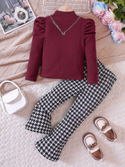 Wine red ribbed puff sleeve top with houndstooth flare pants and butterfly necklace.