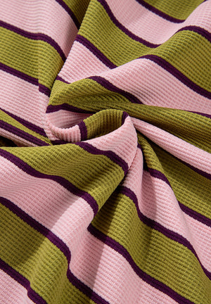Waffle knit cropped top with pink, green, and purple stripes.