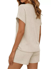 Ribbed knit loungewear set in apricot, featuring a short sleeve top and shorts.